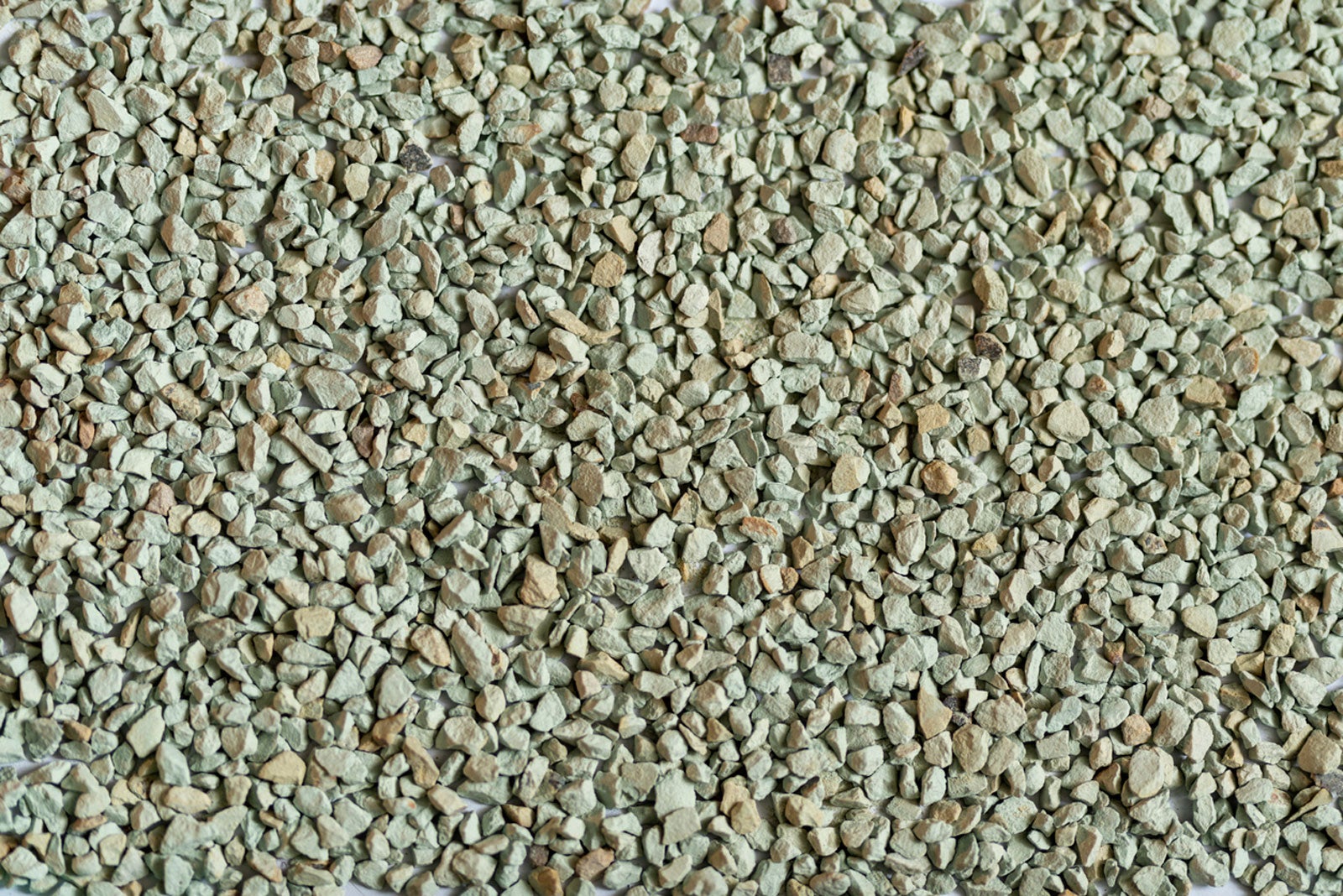 Pale teal clinoptilolite zeolite granules at 4-6mm grade for cactus soil cation exchange